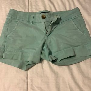 Distressed mint colored shorts